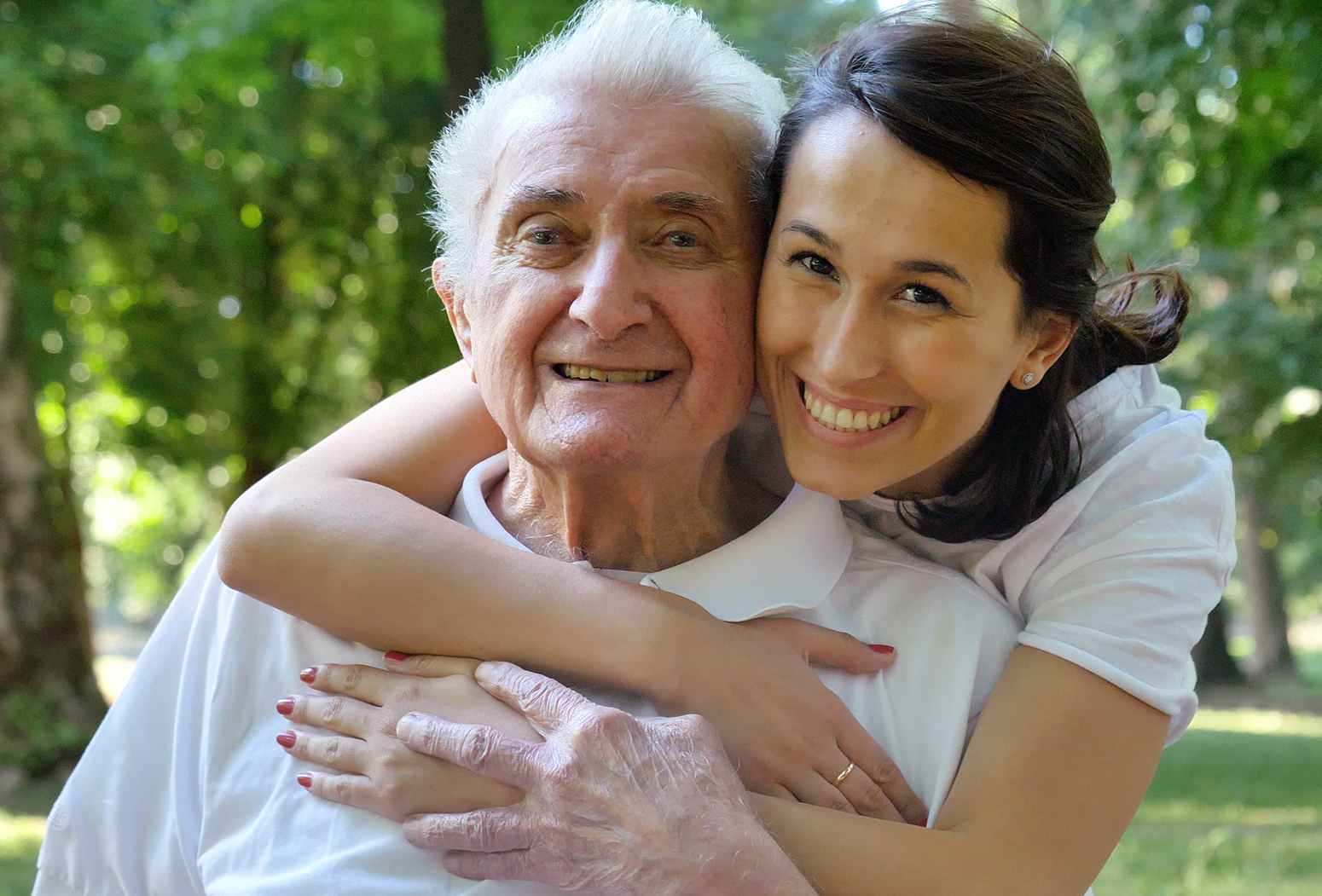 woman hugging older man